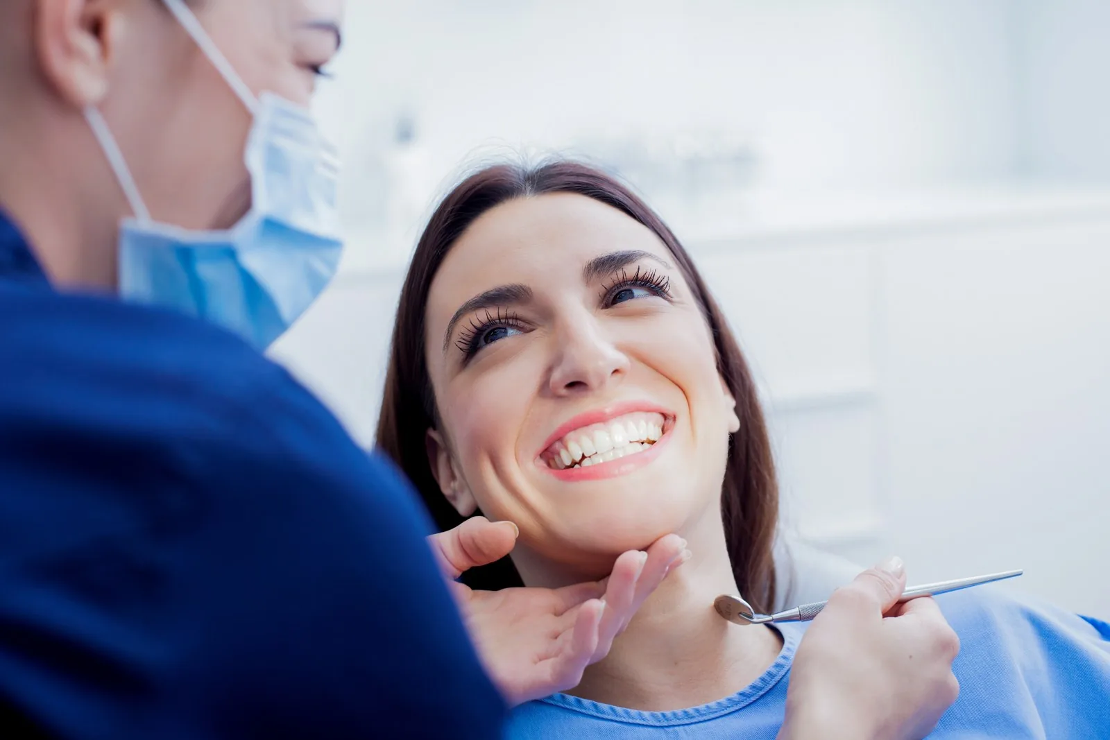 A patient smiling in the dental chair